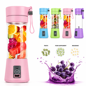 A portable electric blender shown on a white background, with a large pink version in front and four smaller color variants above it (blue, green, pink, purple). The main blender is filled with fruit slices, dragon fruit, and watermelon.